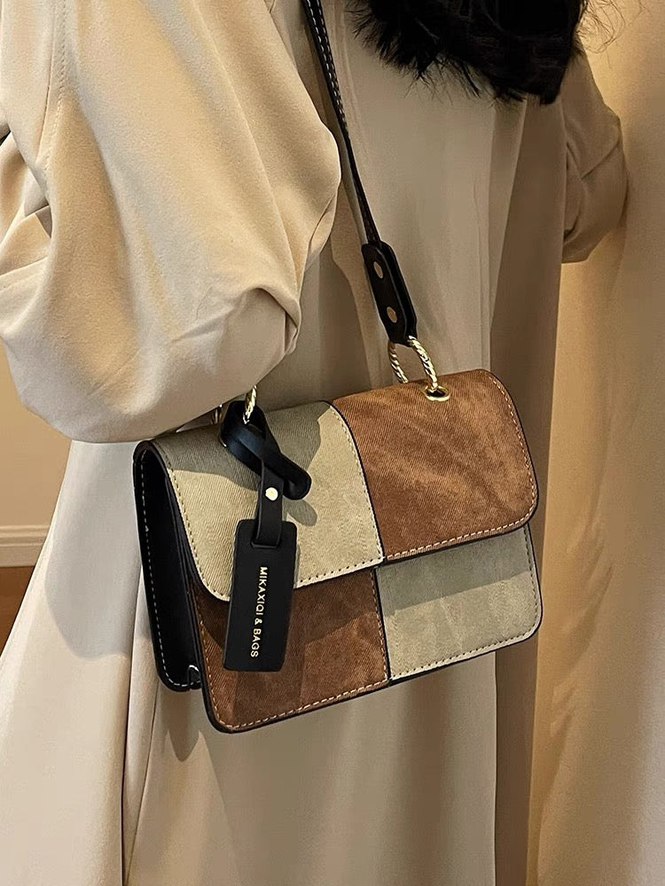 Borsa a tracolla piccola con design di nicchia che unisce verticalmente