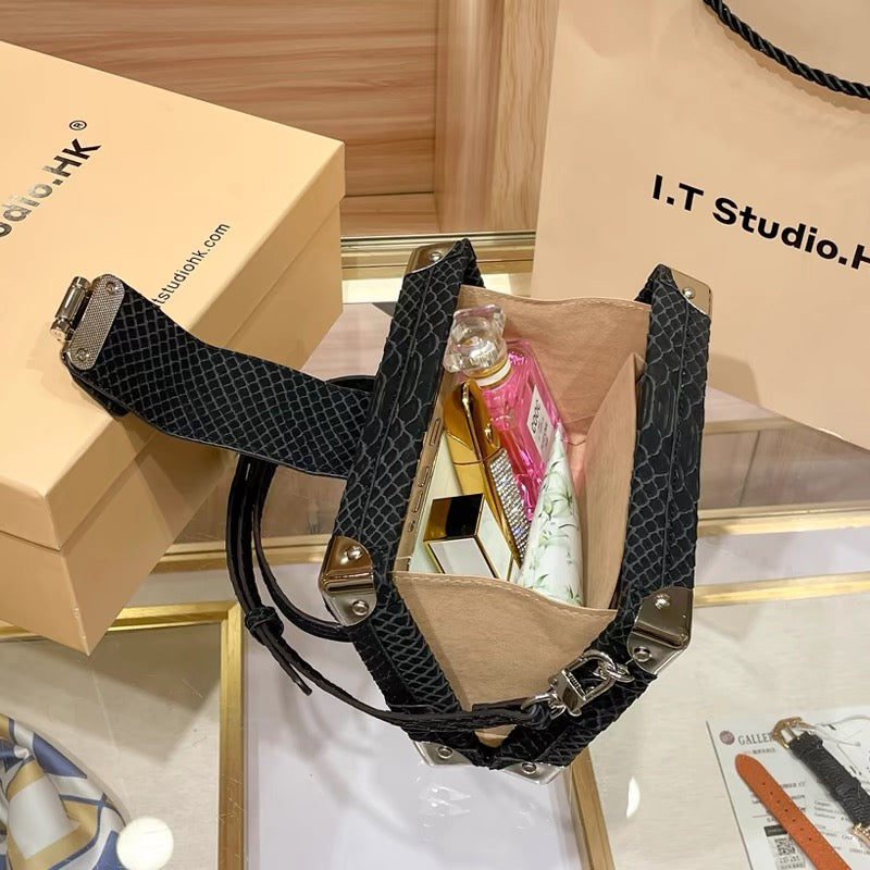 Mini borsa rigida con motivo a serpente