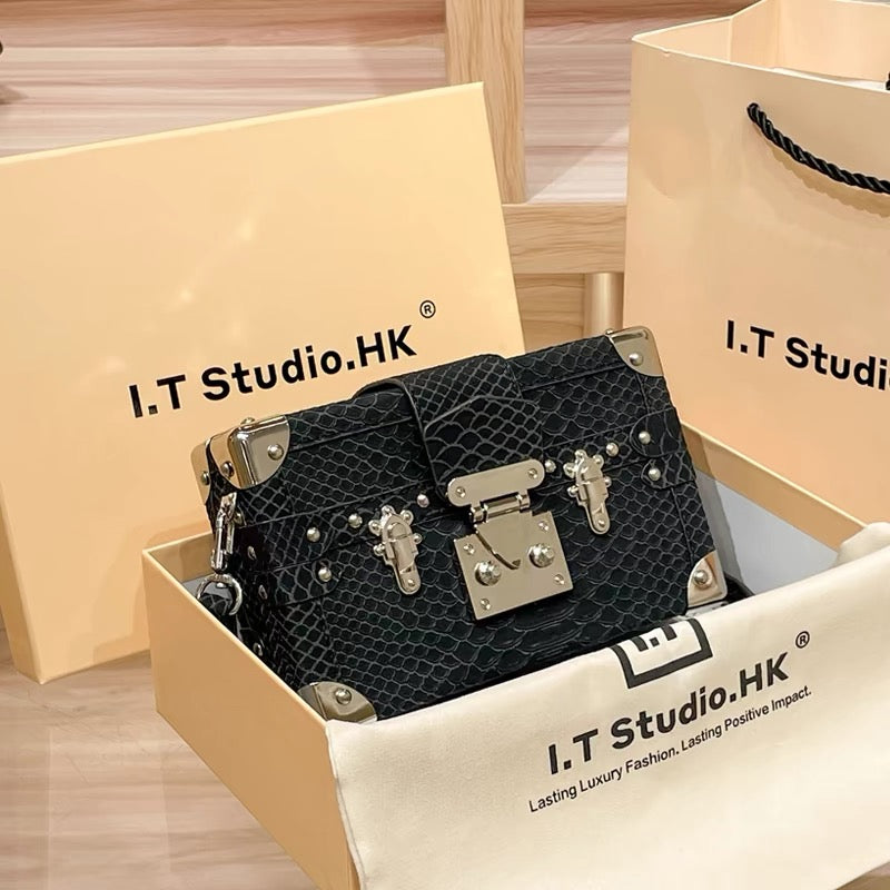 Mini borsa rigida con motivo a serpente